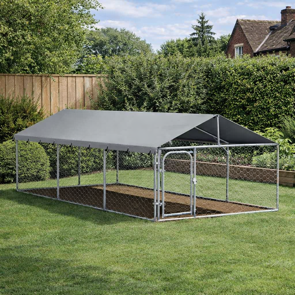 Outdoor dog kennel with roof installed on lawn in garden setting, featuring steel frame and mesh panels