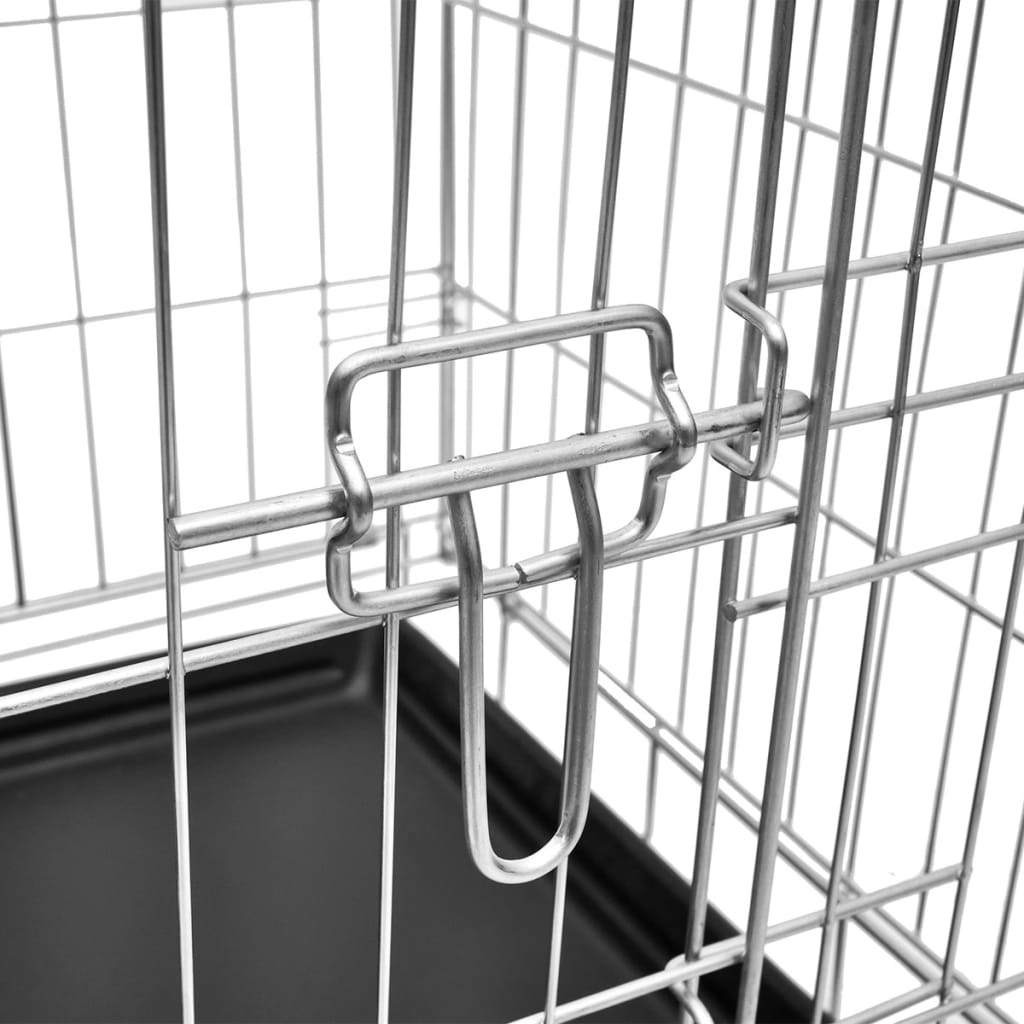 Close-up of metal door latch mechanism on galvanised steel dog crate